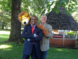 From right: DOC the Clown, aka David Polley, WCCM Vice President of Africa and Asia Jaideep Jesudoss, and Larry the Lion puppet that was stayed with the ministers of Kenya when the WCCM team left.